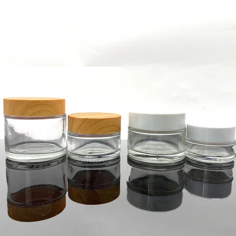 Botella de crema cosmética de vidrio impresa por transferencia de agua con grano de madera