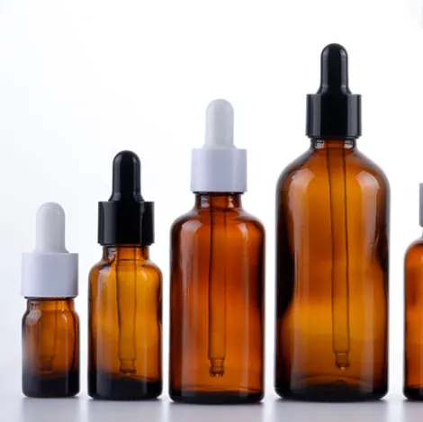 Amber dropper bottles arranged in multiple sizes