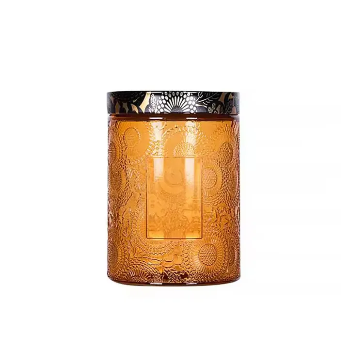 Amber candle jar with embossed texture and label area