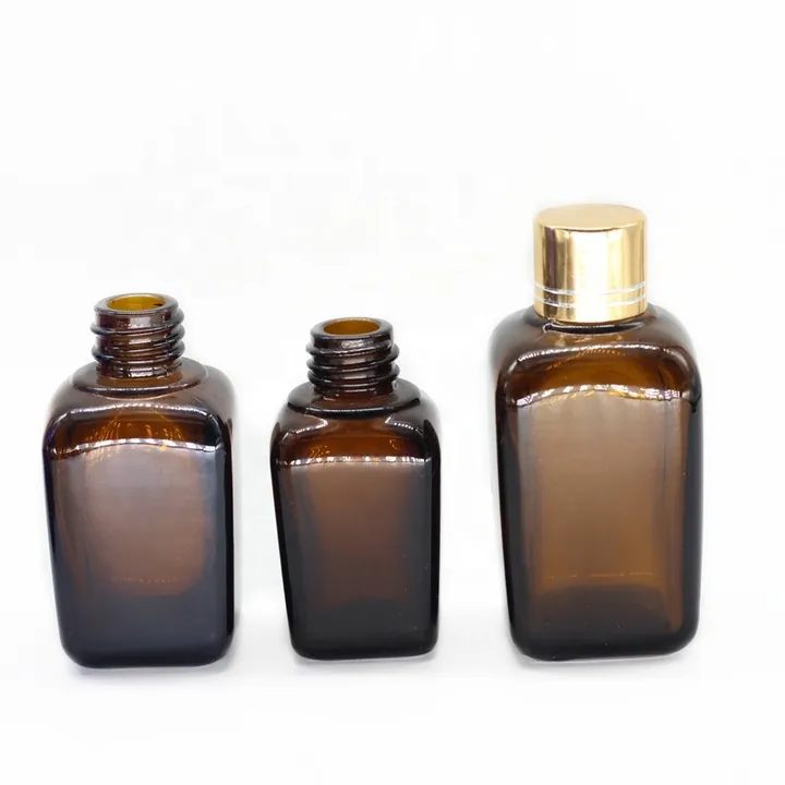 Three amber square glass bottles in different capacities