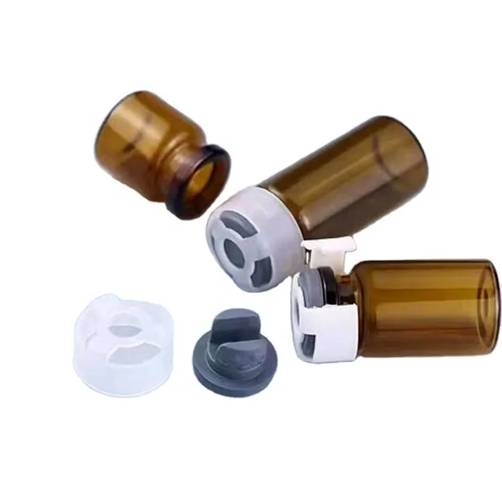 Amber glass vials with white plastic caps and gray plug accessories