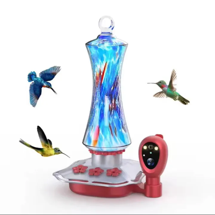 Blue glass bird feeder with hanging garden display