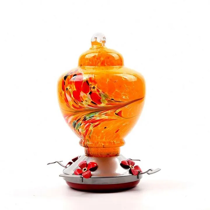 Orange round glass bird feeder with hanging structure