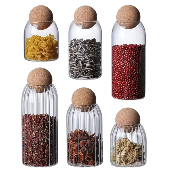 Round glass jars with cork stoppers and dry foods