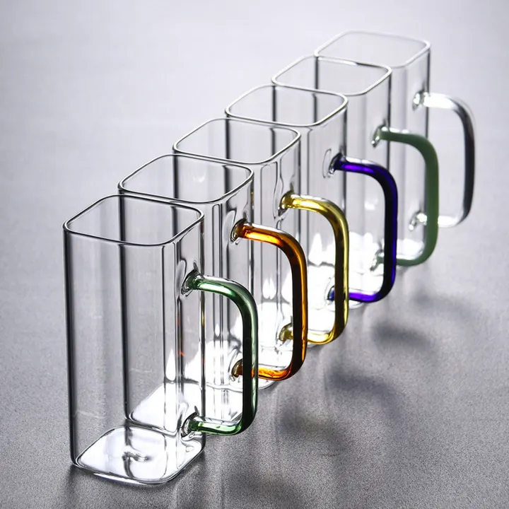 Multiple square glass cups with colorful handles displayed together