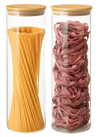 Glass storage jars with bamboo lids holding pasta