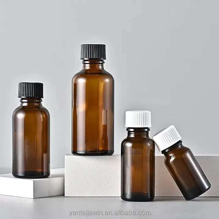 Amber Boston round bottles with black and white caps