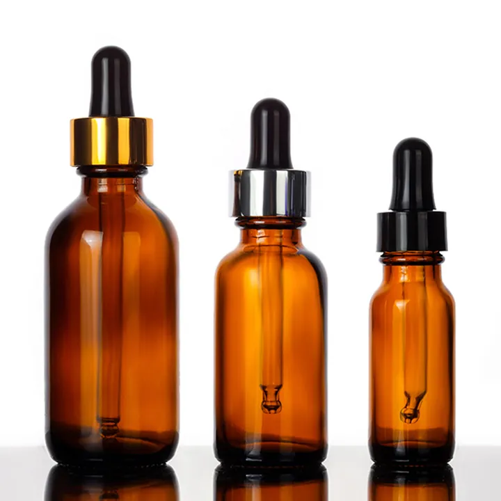 Amber Boston round bottles with gold silver and black droppers
