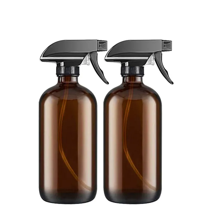 Two amber Boston round trigger spray bottles