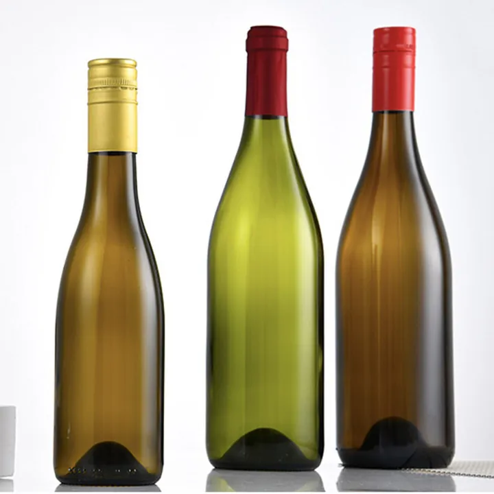Three Burgundy wine bottles with different colored caps