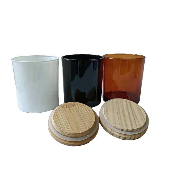 White black and amber glass candle jars with wooden lids