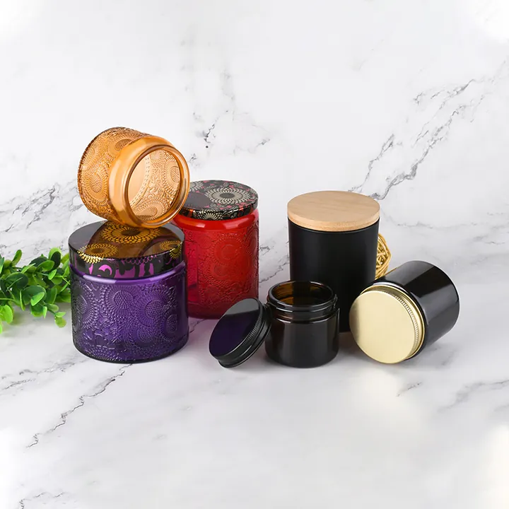 Colored glass candle jars with embossed textures metal lids and wood lids