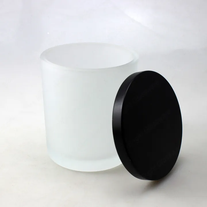 Frosted white cylindrical candle jar with black lid