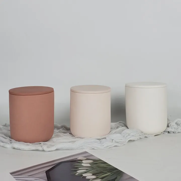 Pink beige and white candle jars displayed together