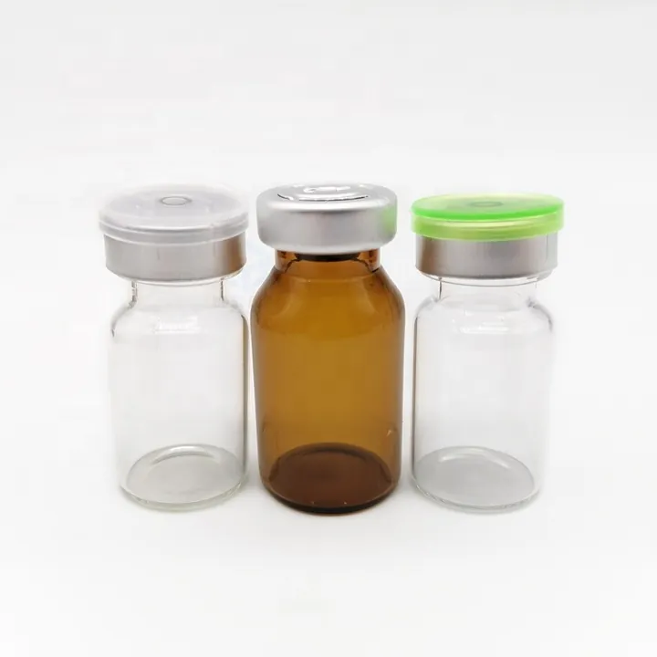 Clear and amber glass vials with gray and green flip caps