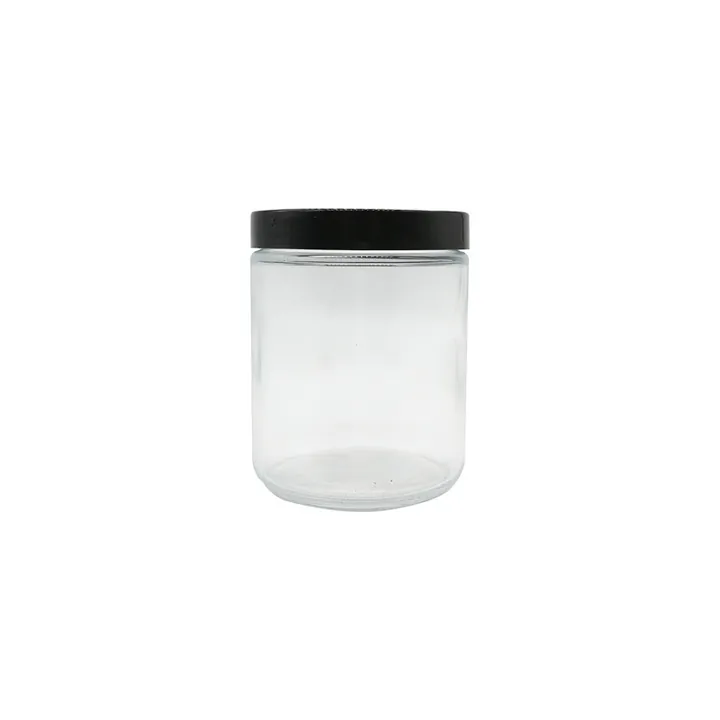 Clear cylindrical glass candle jar with black screw lid