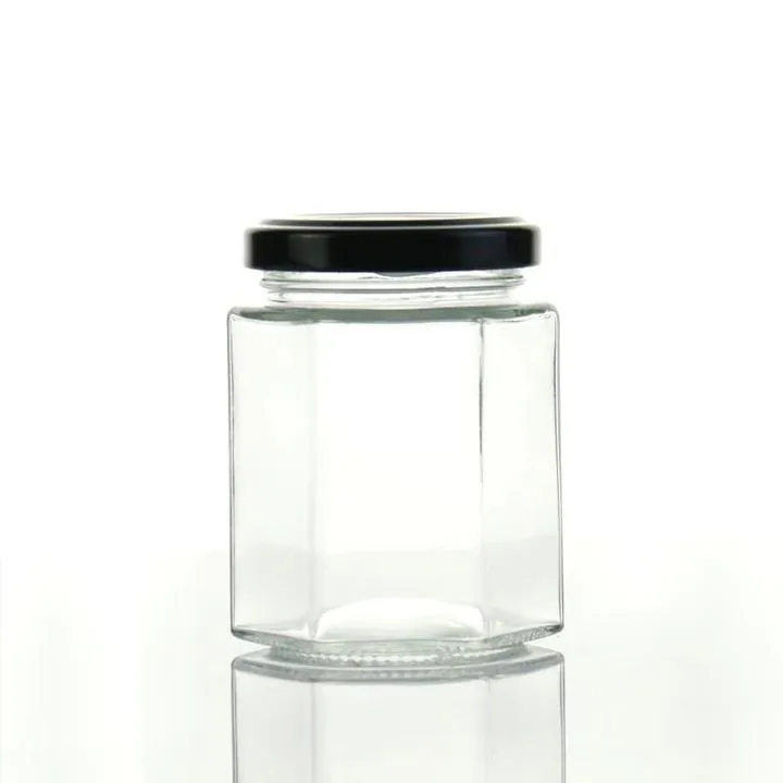 Clear hexagon glass jar with black metal screw lid