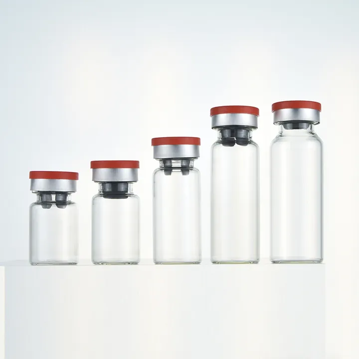 Clear glass vials in different sizes with red and silver caps