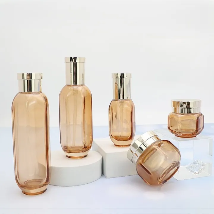 Amber cosmetic glass bottles and jars in different sizes