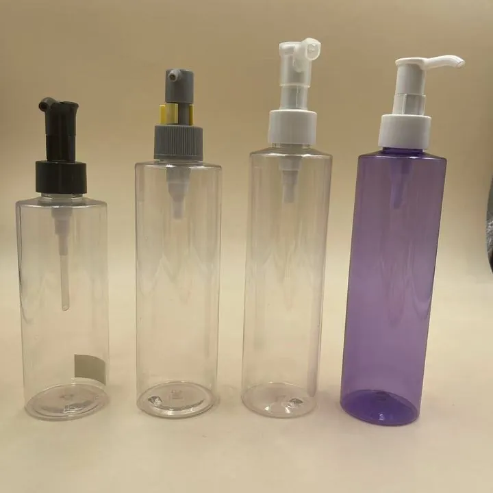 Tall clear and purple cosmetic pump bottles for lotion packaging