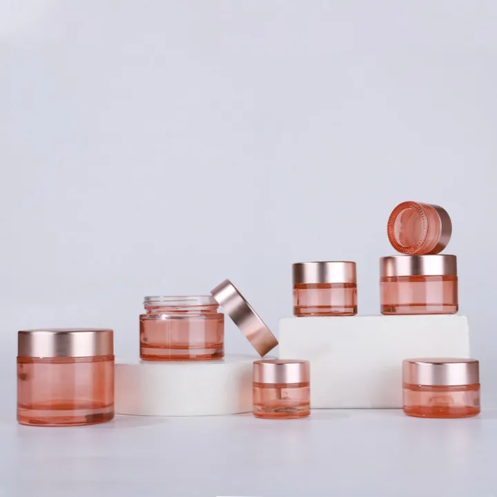 Pink cosmetic glass jars in multiple sizes