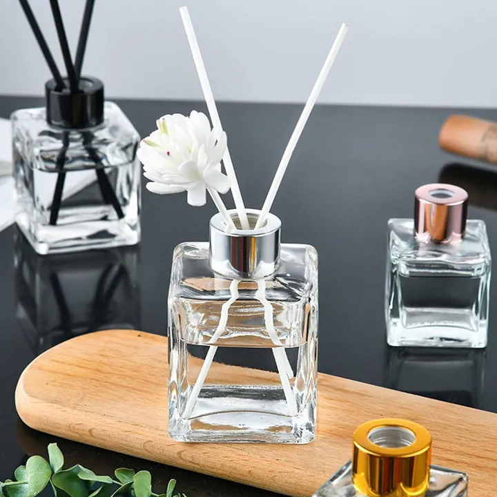 Clear square diffuser bottles with reeds fragrance flowers and different colored caps