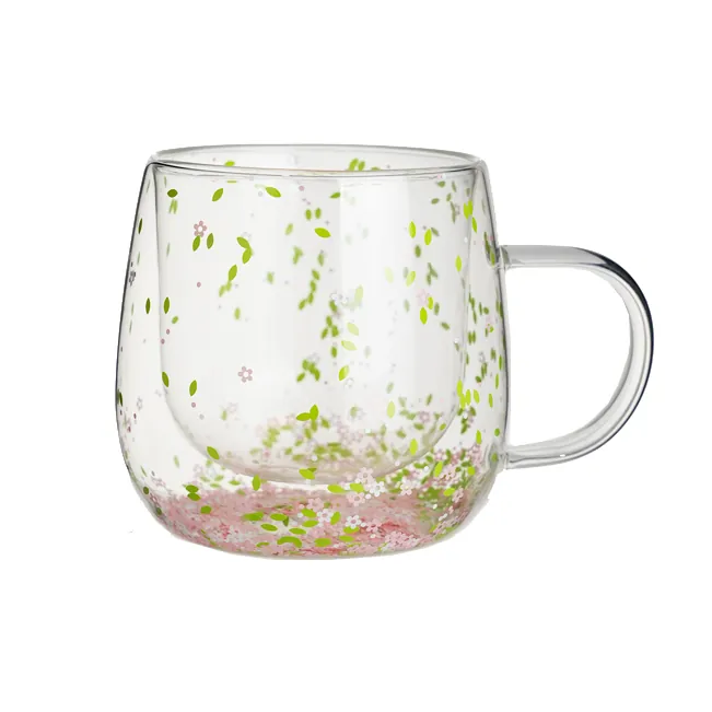 Double wall glass mug with floral and glitter decoration