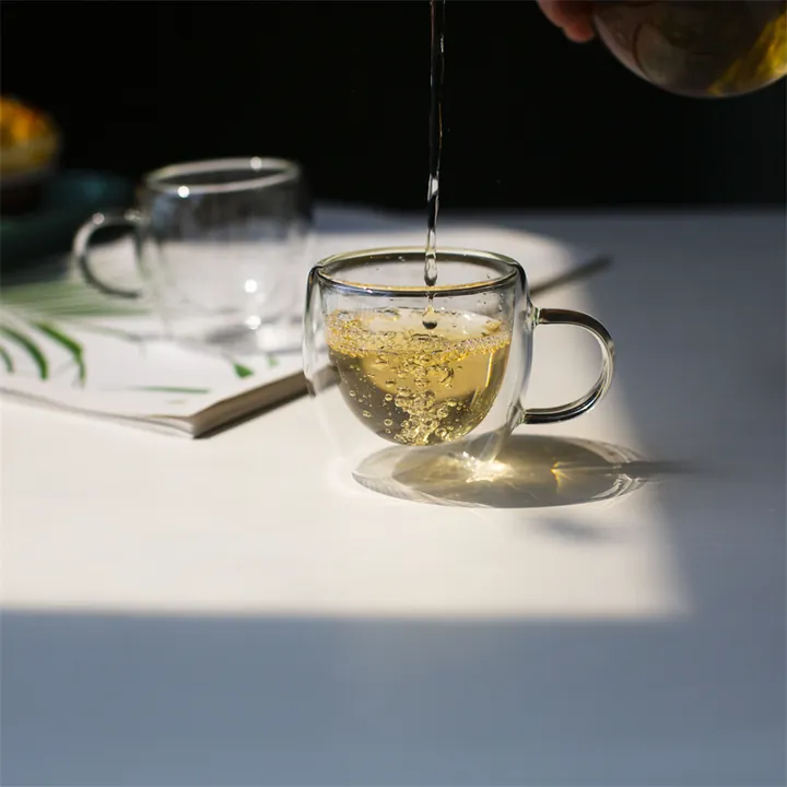 Small handled double wall glass tea cup