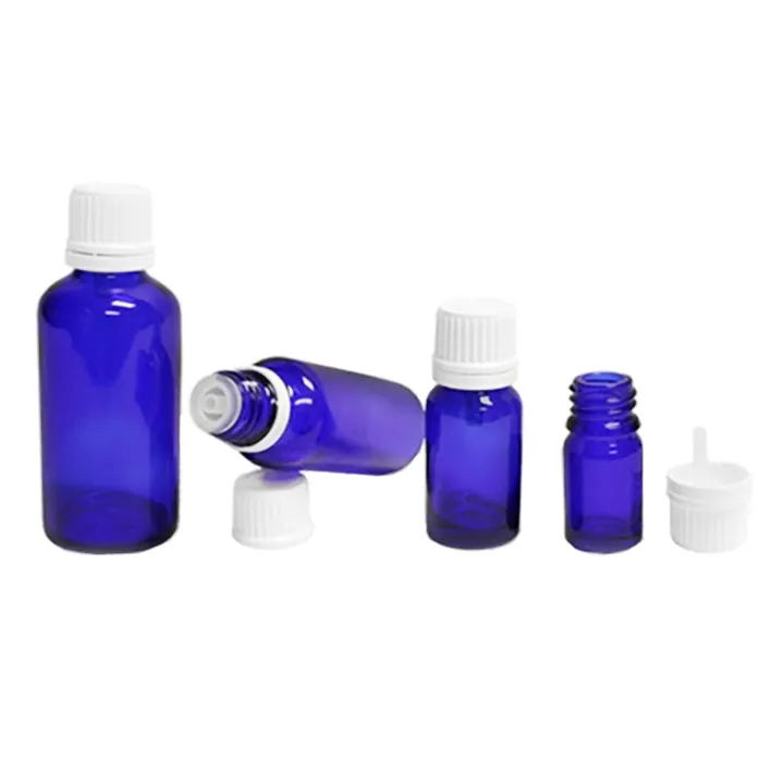 Blue glass bottles with white security caps and inserts