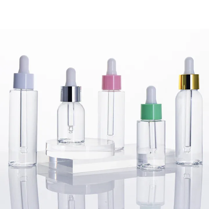 Clear glass dropper bottles with different colored dropper caps