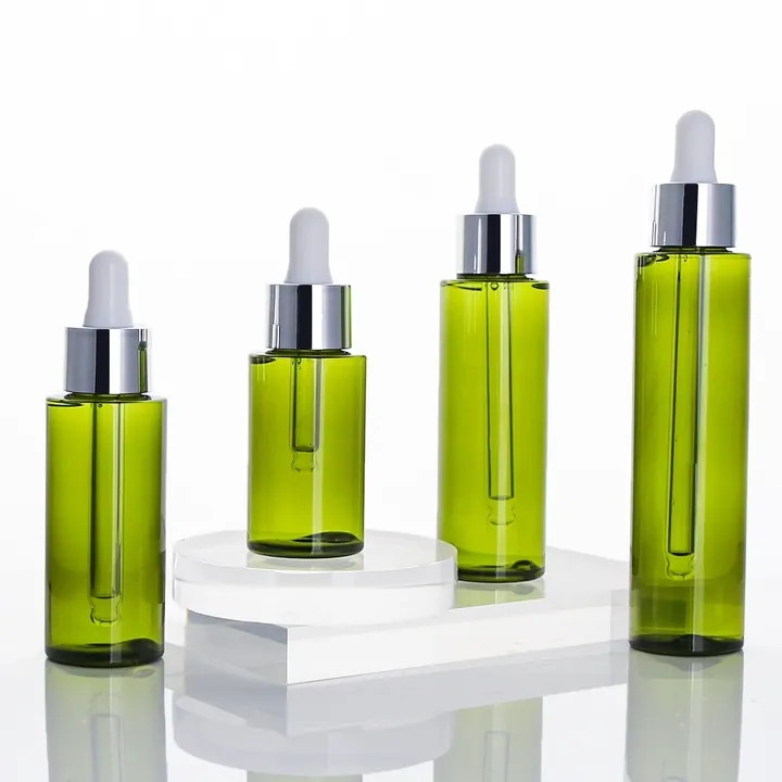 Green glass dropper bottles displayed in assorted capacities