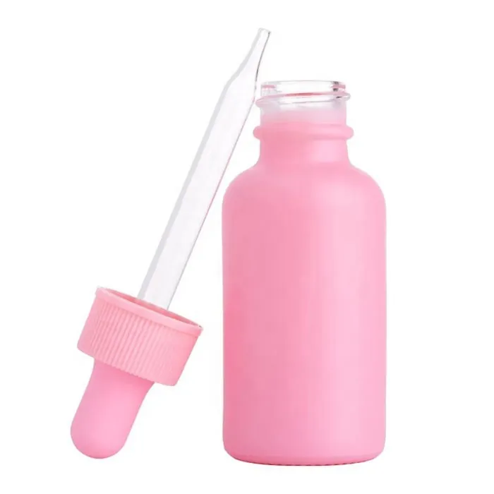 Pink glass dropper bottle with opened dropper cap
