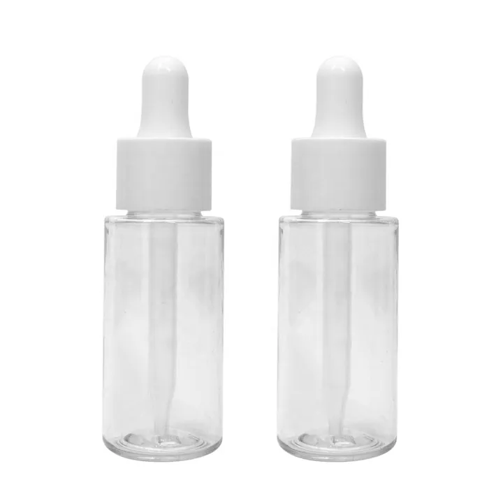 Two clear glass dropper bottles with white caps