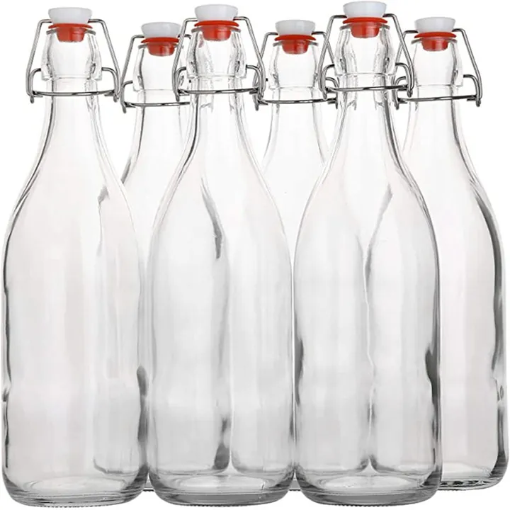 Six clear swing top glass bottles displayed together