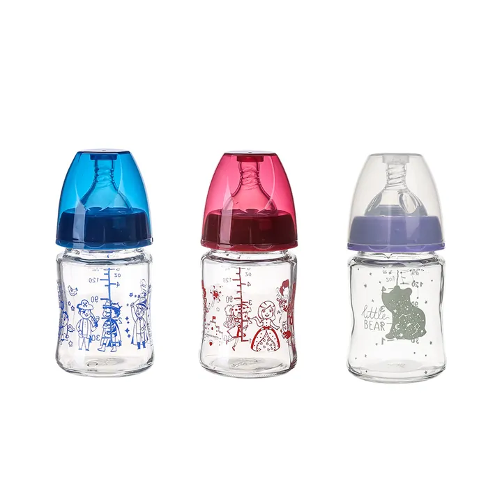 Three small glass baby bottles with blue red and purple caps