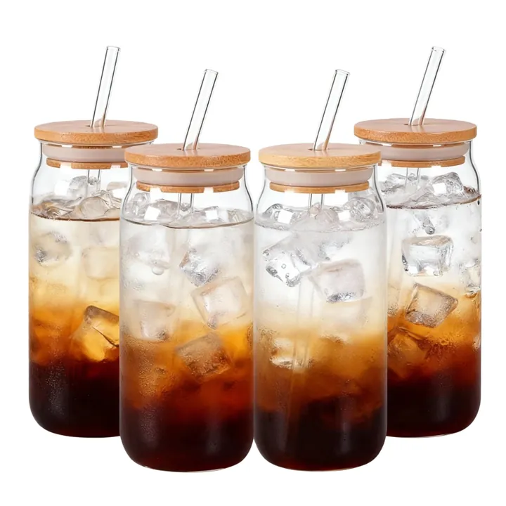 Glass beverage bottles with bamboo lids and glass straws