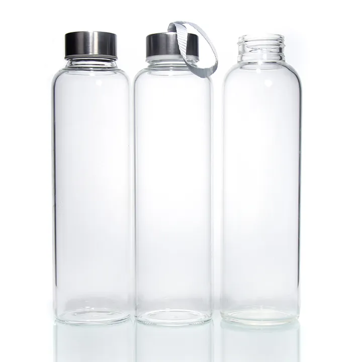 Three clear glass drinking bottles with metal lids
