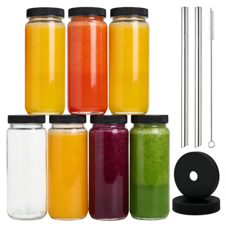 Glass juice bottles with black lids metal straws and cleaning brushes