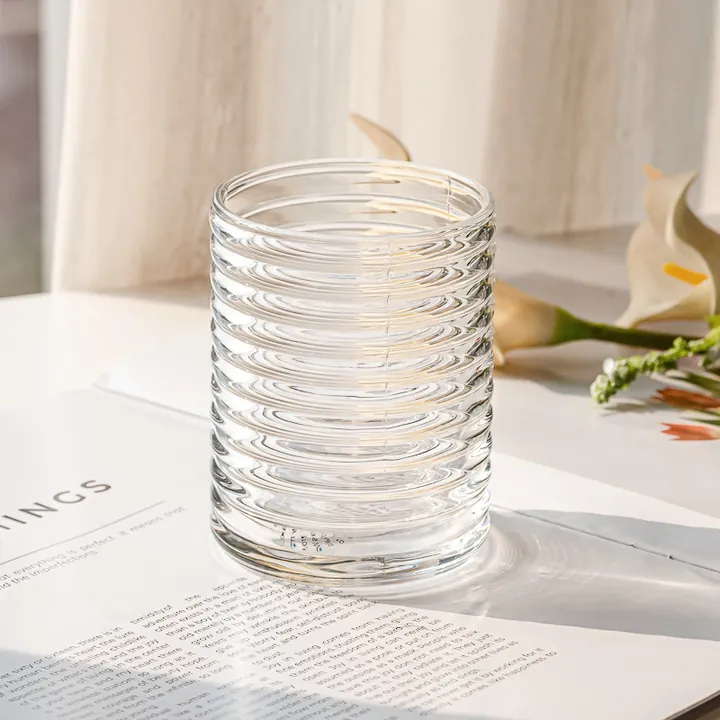 Clear ribbed glass candle jar with visible texture