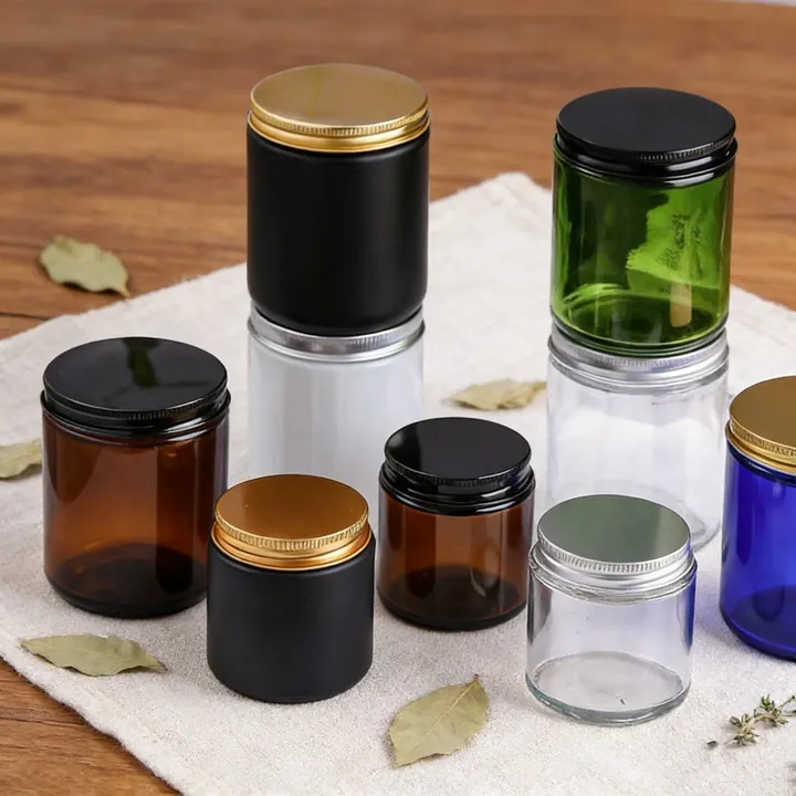 Glass candle jars with different colors sizes and lids
