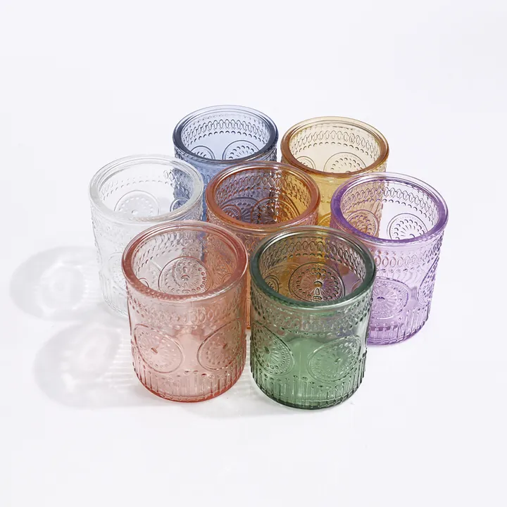 Colorful textured glass candle jars displayed from above