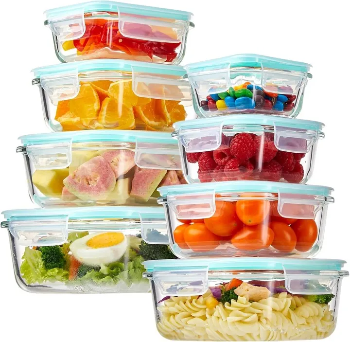 Glass containers filled with fruits vegetables and snacks