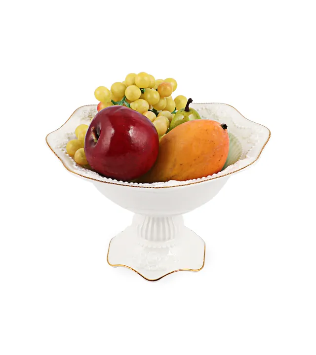 Weiße Obstschale auf Sockel mit goldenem Rand und Obst