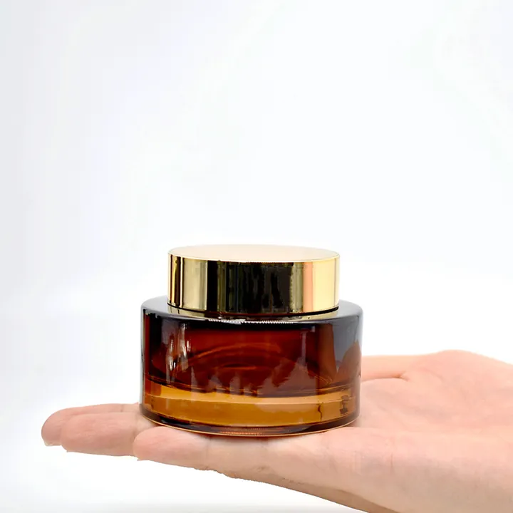 Amber glass cream jar with gold screw cap