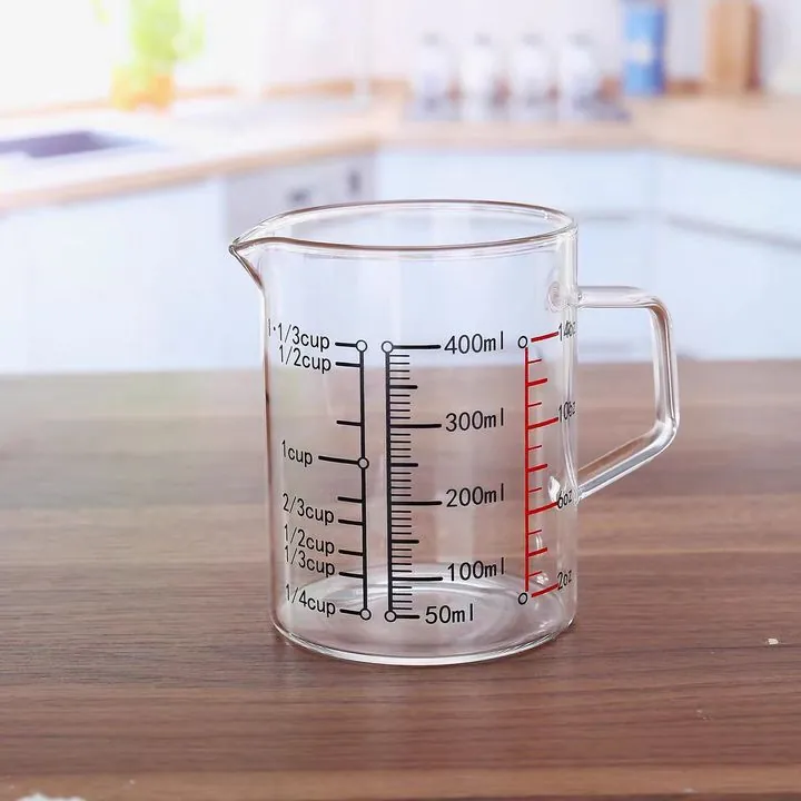 Glass kitchen measuring jug with red and black markings