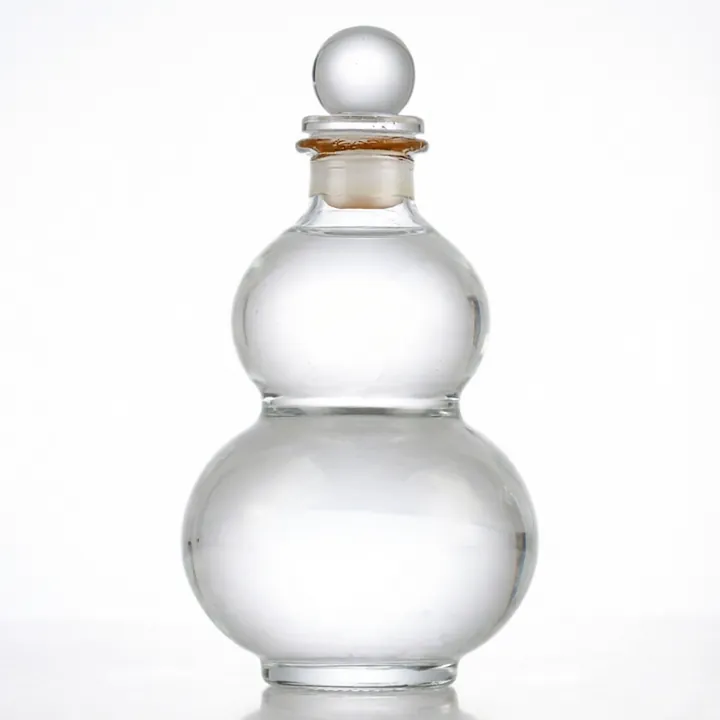 Clear gourd shaped glass bottle with round glass stopper