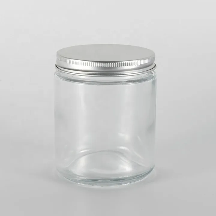 Straight sided clear glass jar with silver metal lid