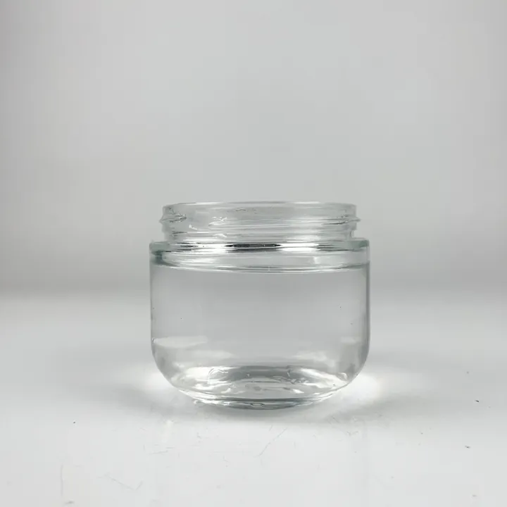Short wide mouth clear glass jar without lid