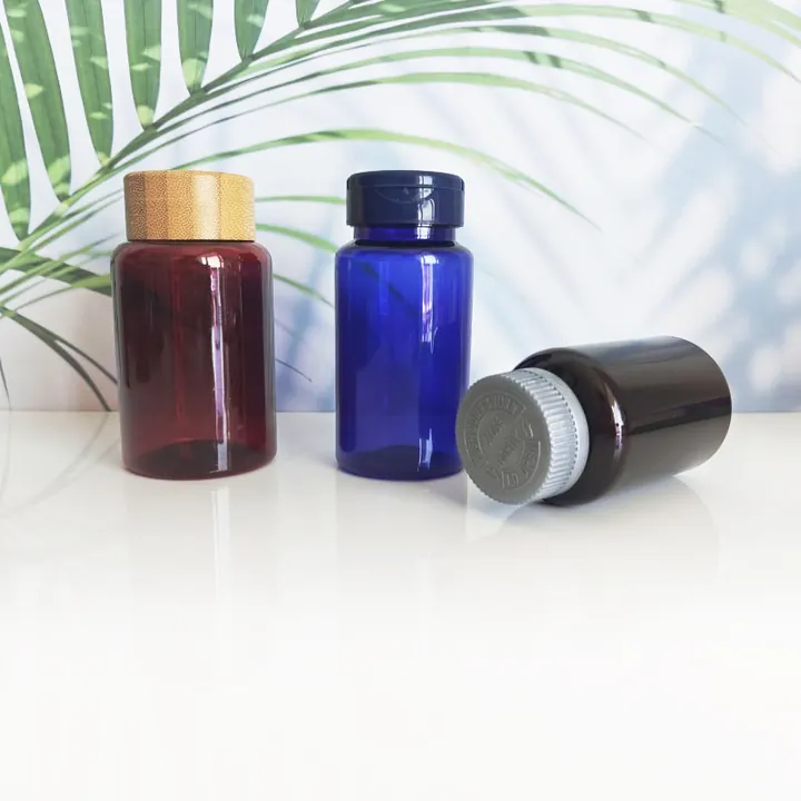 Amber blue and red-brown pill bottles with different lids