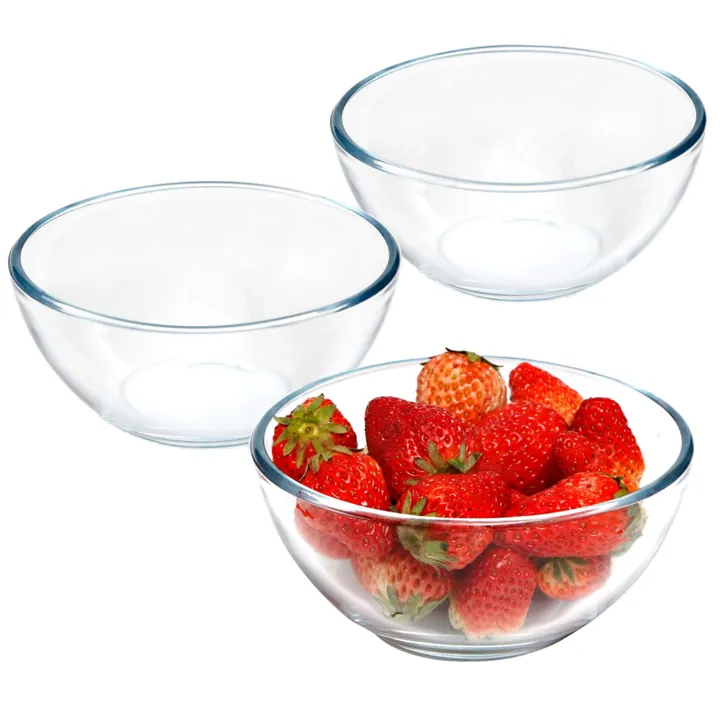 Three glass bowls with strawberries and serving use